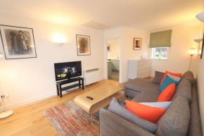 Quiet riverside apartment with views and parking-